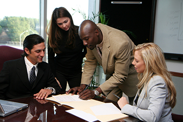 Business team signing contract